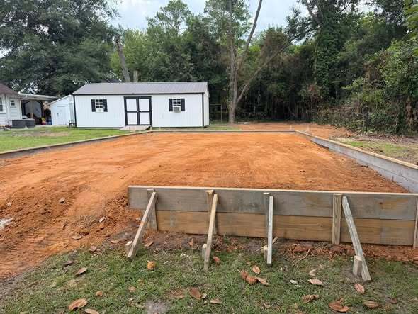 View of the new storeroom construction at Stonewall, preparing the foundation for household furniture donations