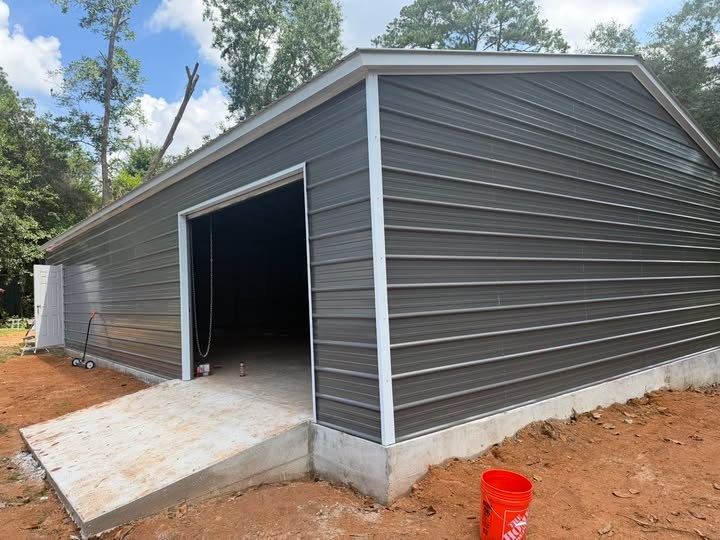 The finished storeroom building standing at the Widows Oil Ministry Stonewall Street location